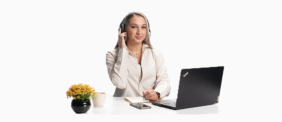 Woman with headphones at laptop, providing support.